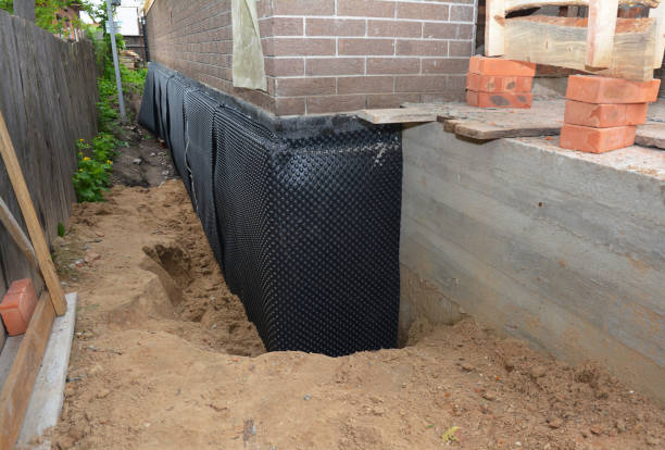 Happy homeowners after waterproofing job in Batesville